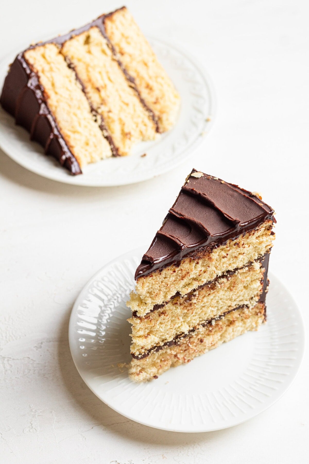 Sliced layered cake filled with chocolate.