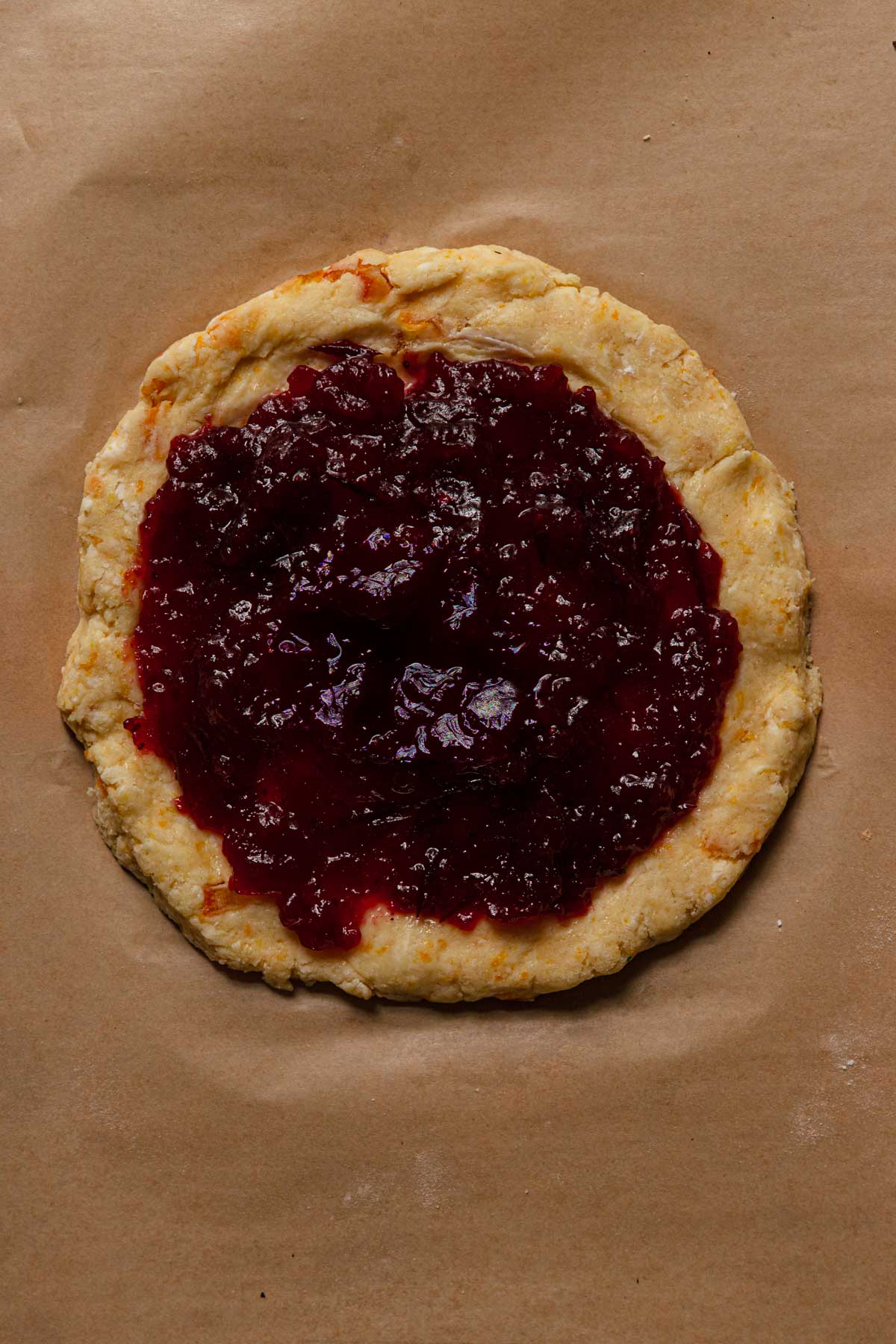 Cranberry scones on a raw scone dough.