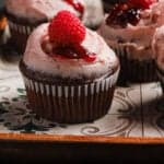 Chocolate cupcakes frosted with raspberry buttercream