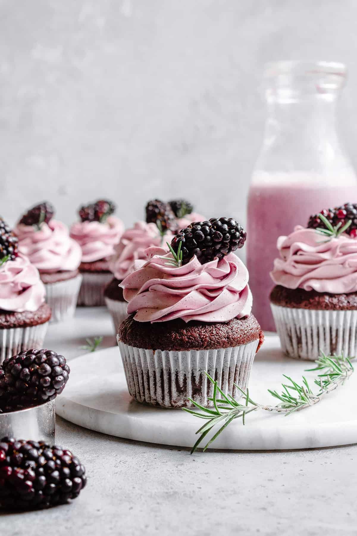 Easy Chocolate Rosemary cupcakes with blackberry buttercream.