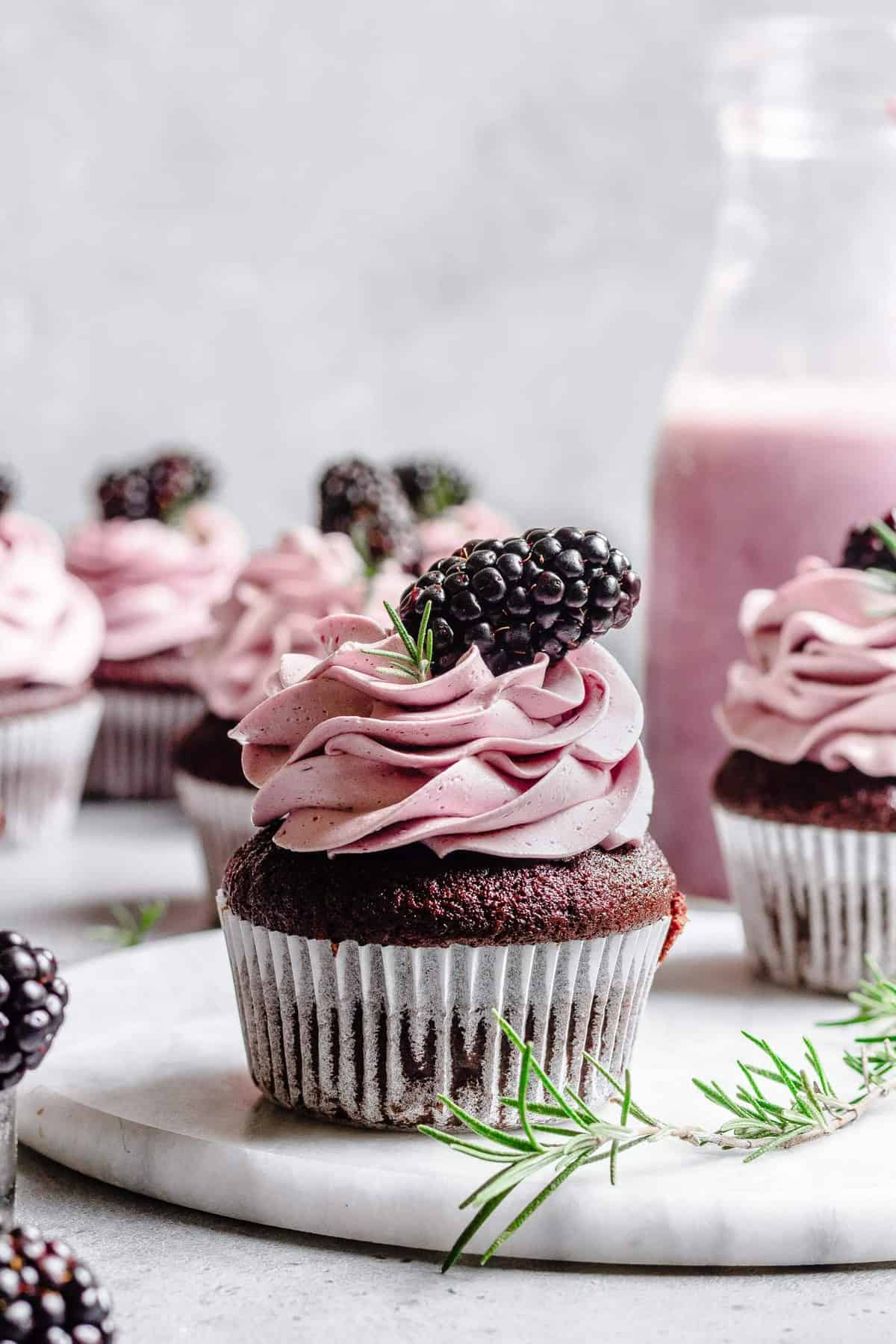 Easy Chocolate Rosemary cupcakes with blackberry buttercream.