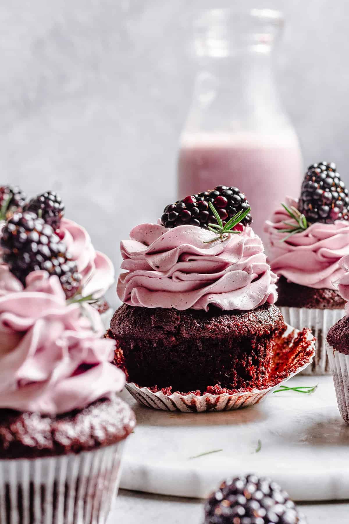 Easy Chocolate Rosemary cupcakes with blackberry buttercream.