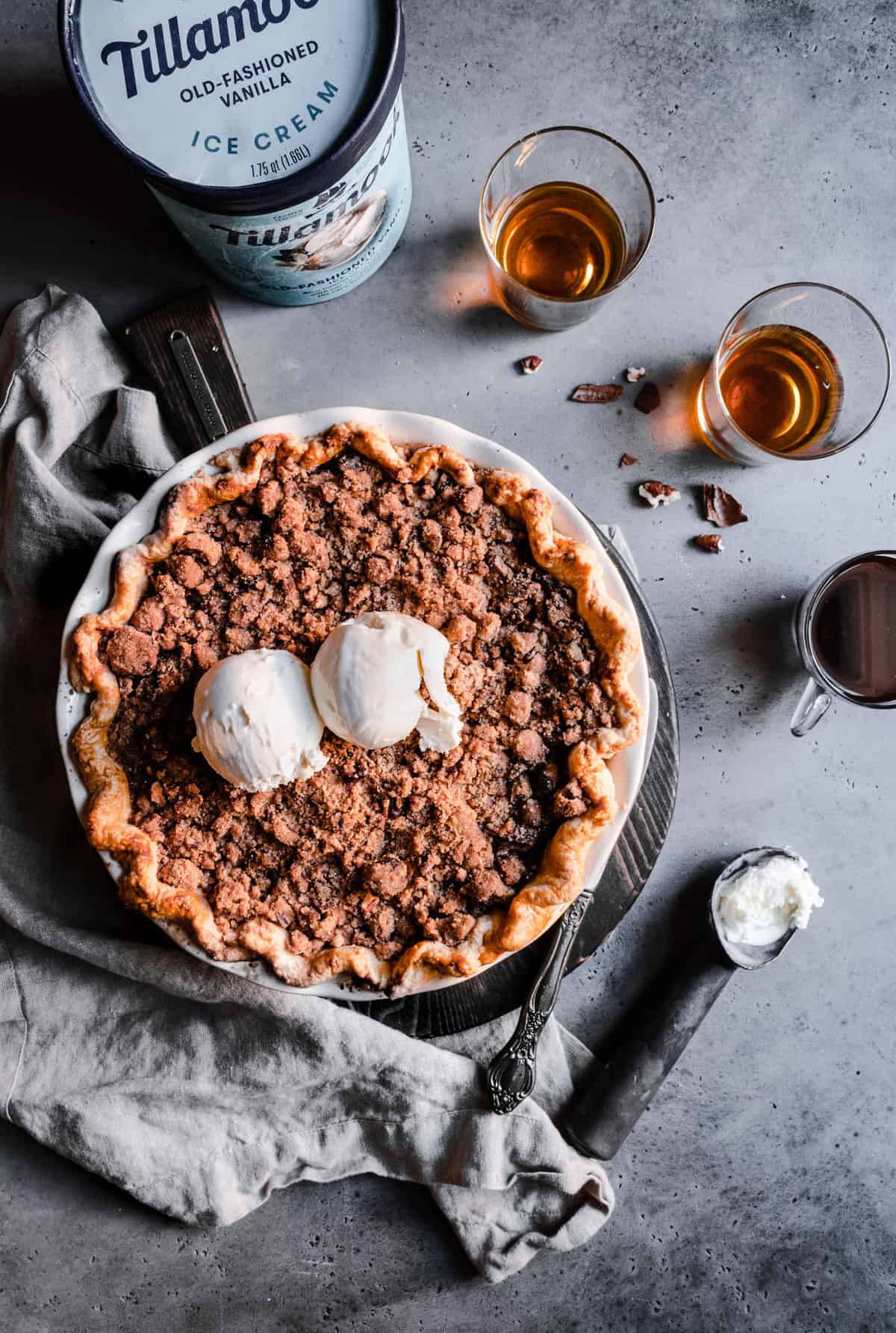 Pear pie with pecan cinnamon streusel topped with Tillamook ice cream.