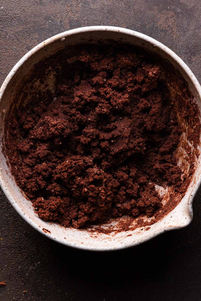 A bowl with chocolate cookie dough,