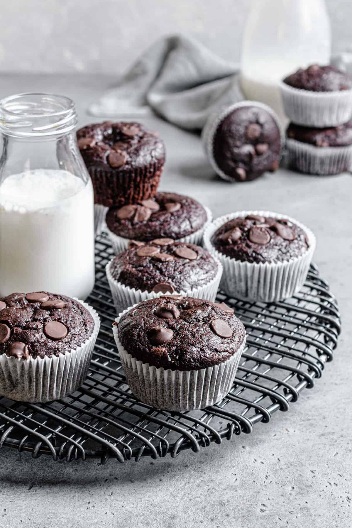 muffins on a rack with a bottle of milk