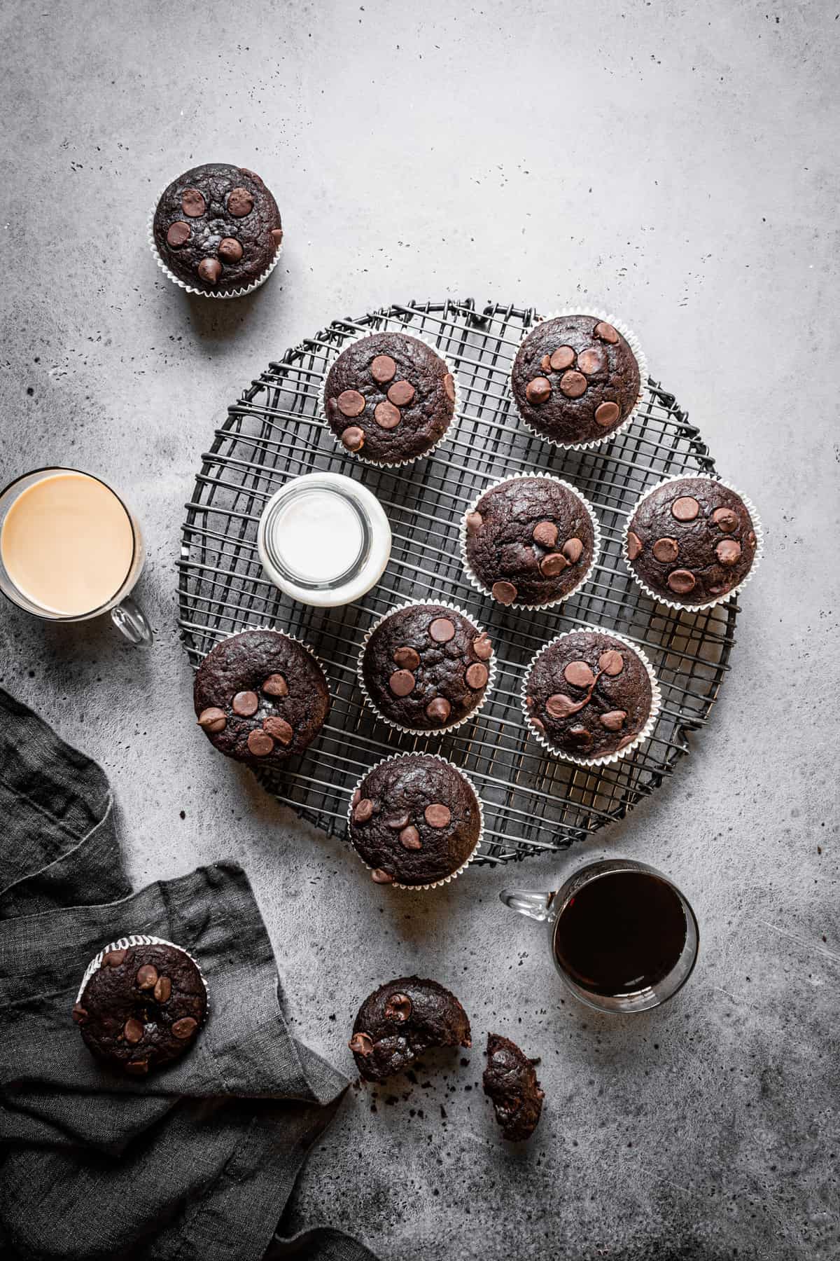 muffins on a rack with coffee cup next to them