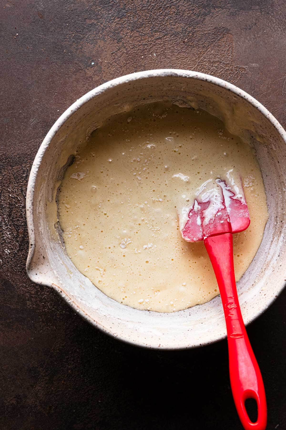 a bowl with egg mixture and a spatula.