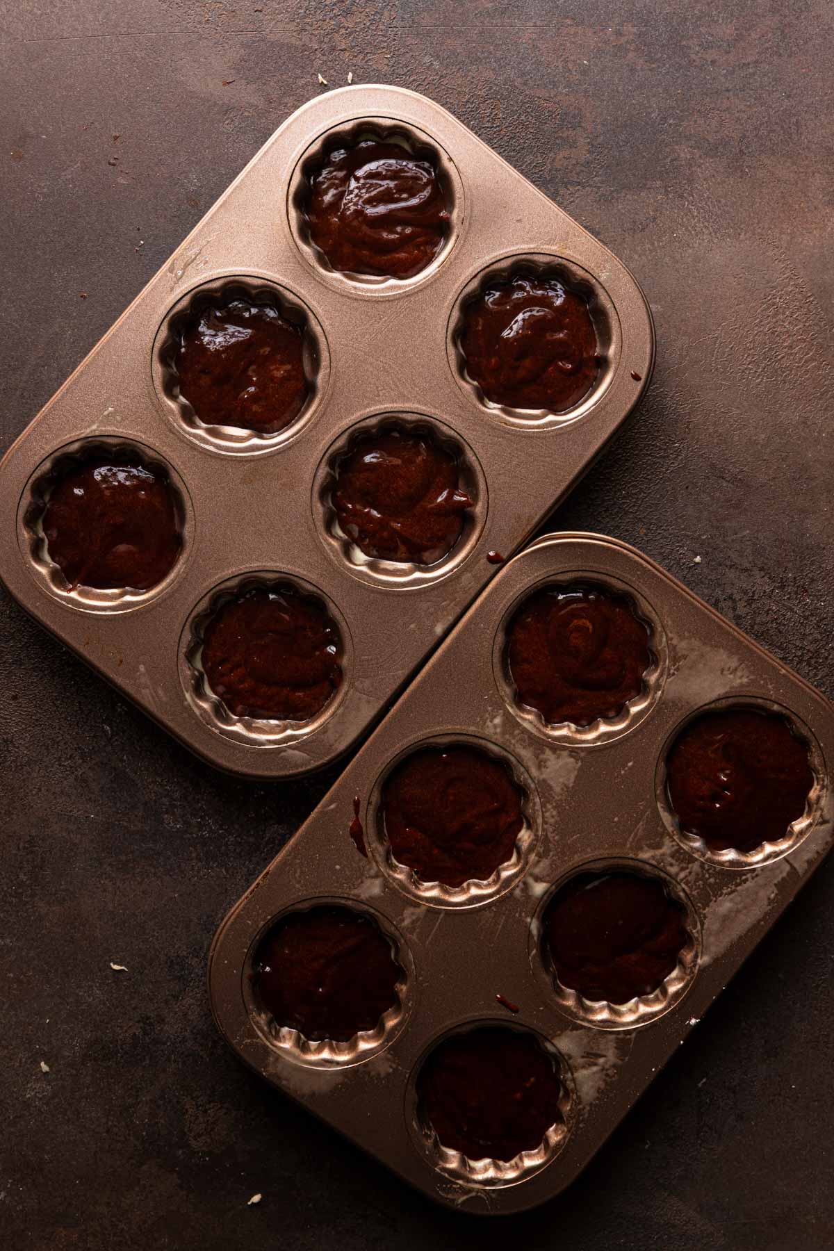 Madeleines molds filled with batter.
