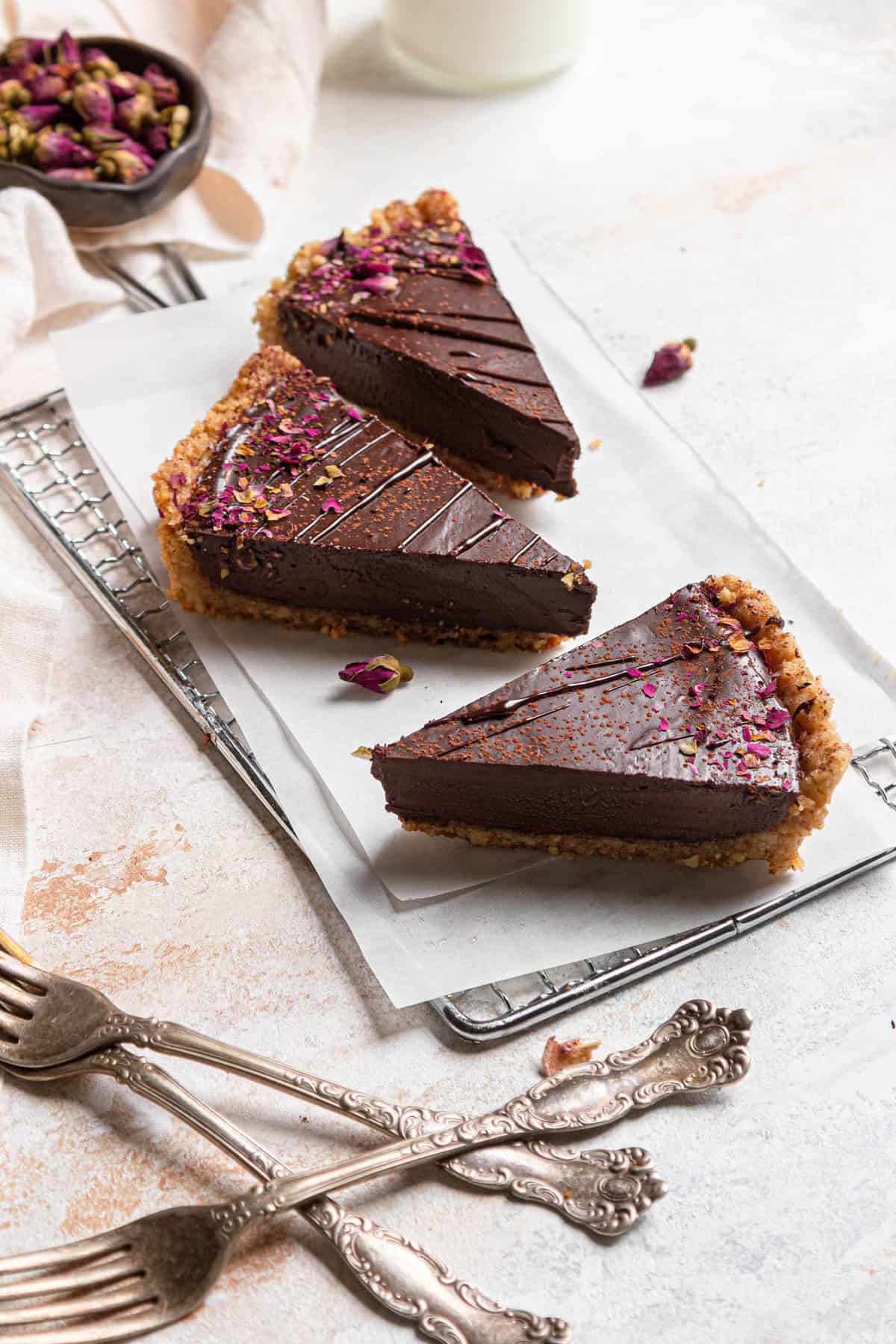 three pieces of chocolate pie on a small rack