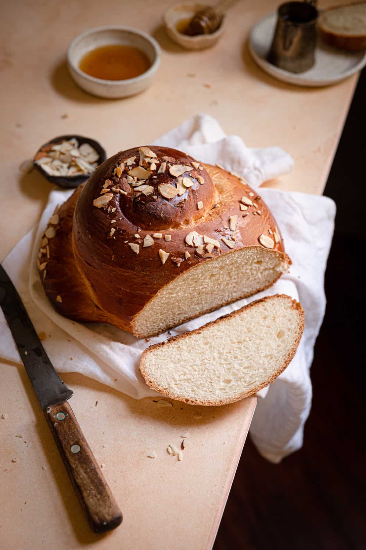 sliced round bread sprinkled with almonds