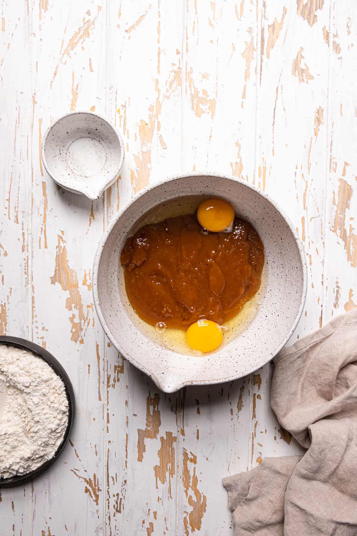 A large bowl with melted butter, sugar and eggs.