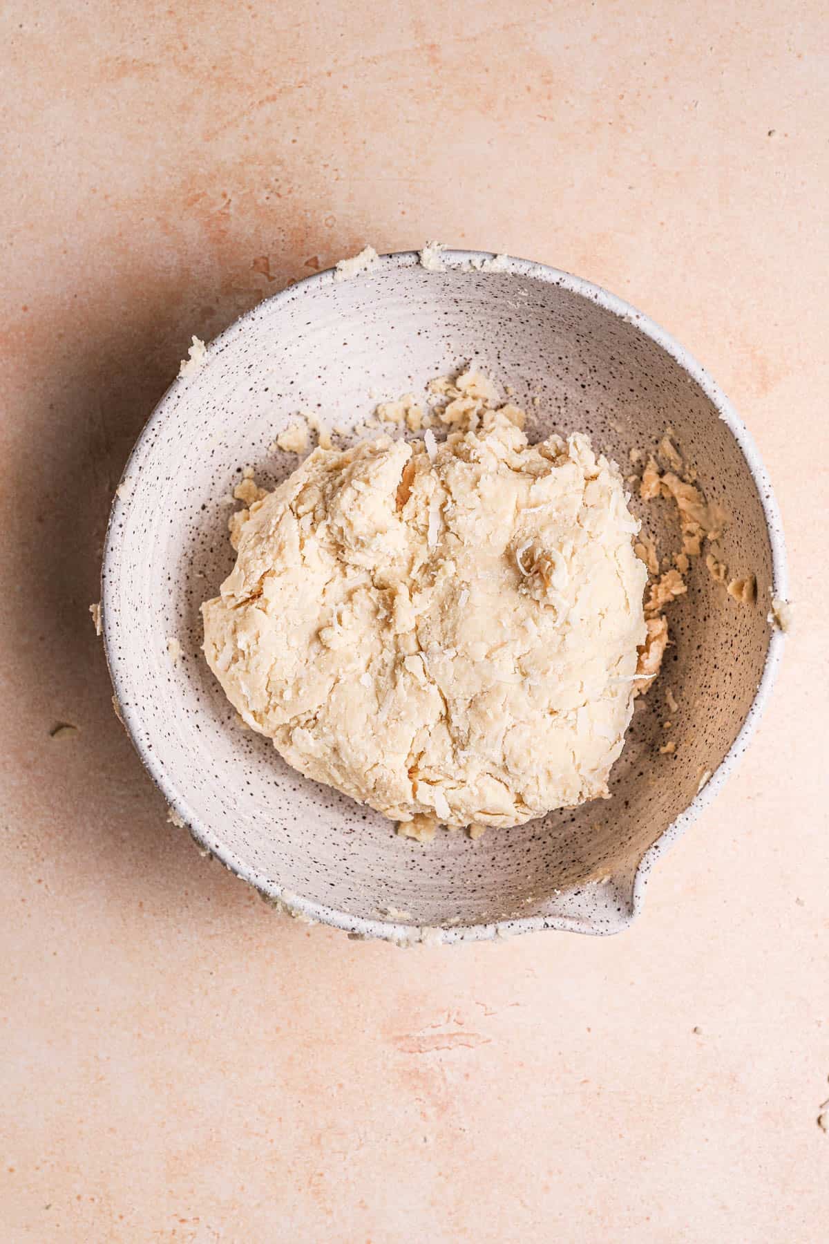 Coconut scones dough in a large mixing bowl.