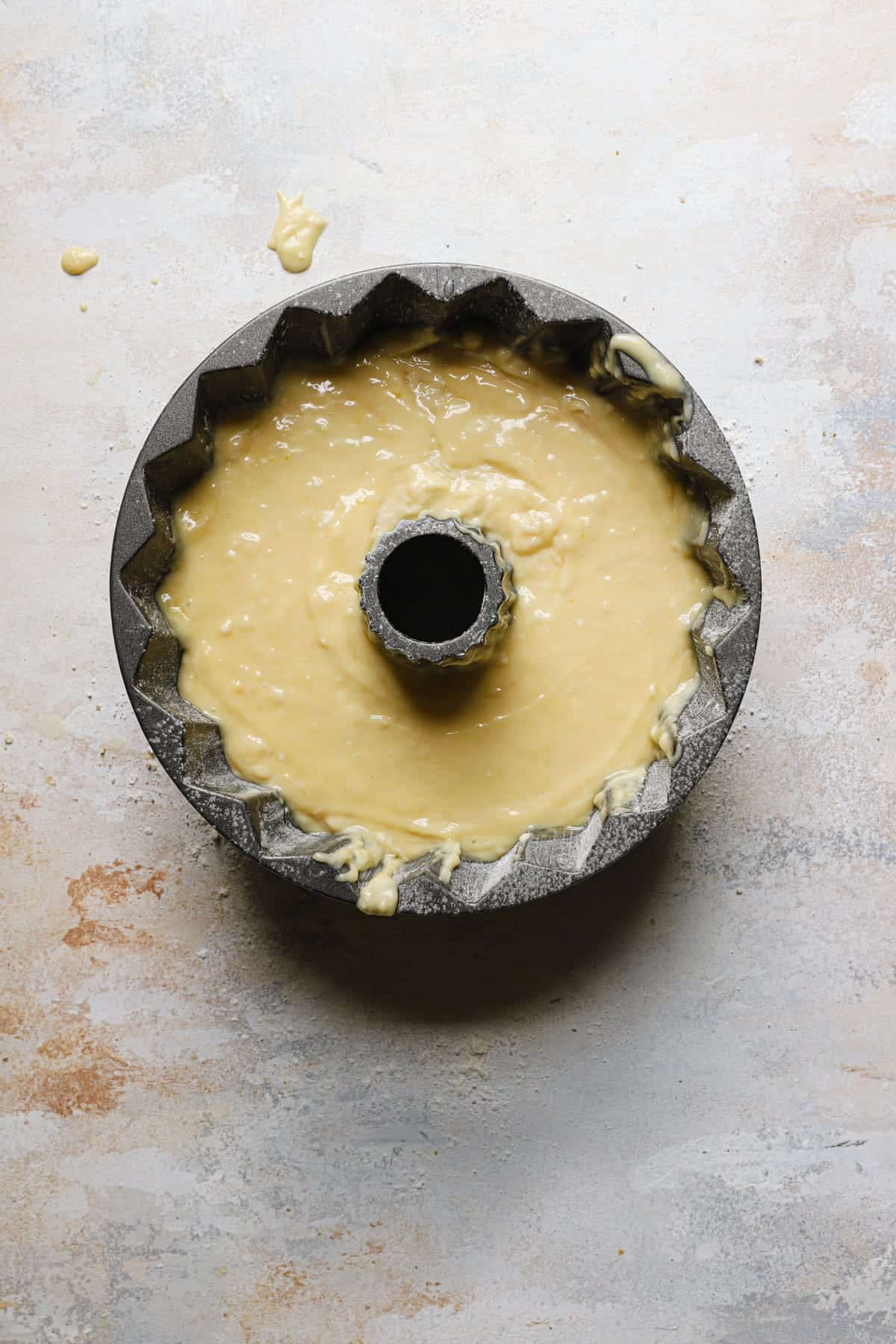 A bunt pan with cake batter.