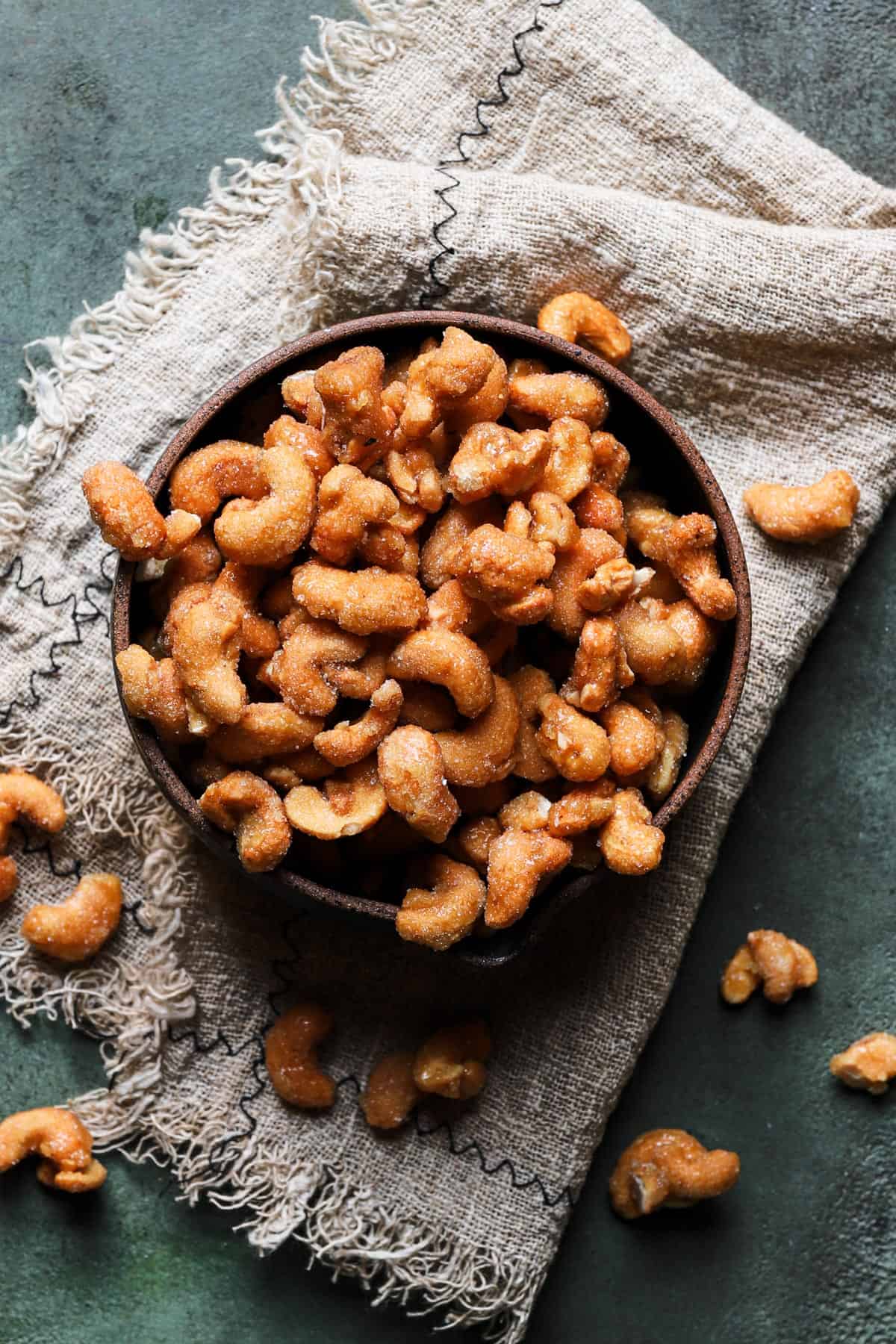 honey roasted cashews coated with sugar in a bowl.