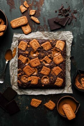 Uncut brownies topped with lotus cookies