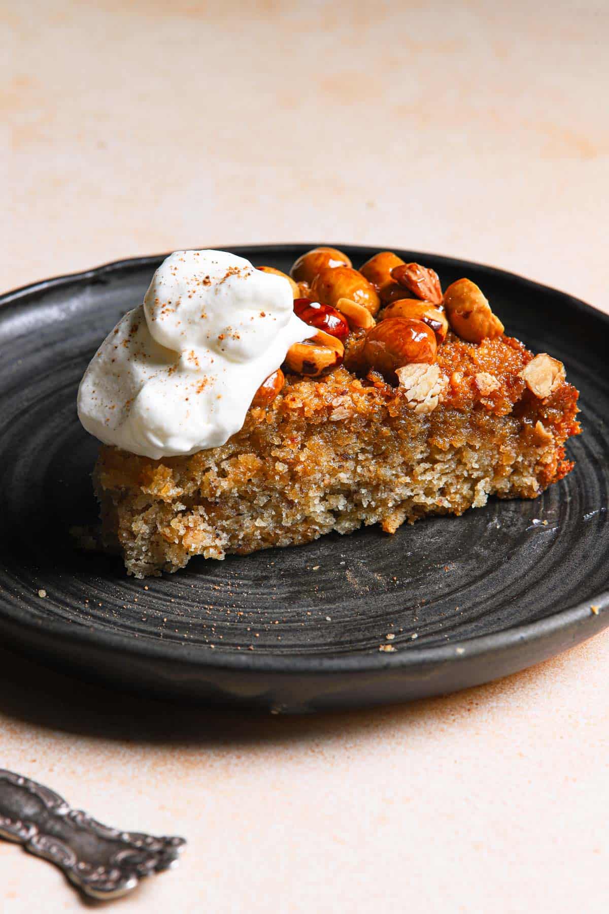 a slice of cake topped with whipped cream