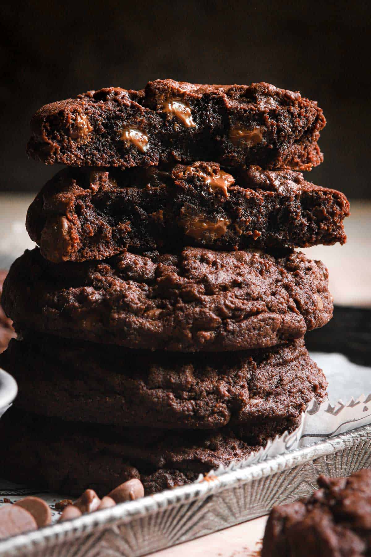 Triple chocolate chip cookies in a pile.