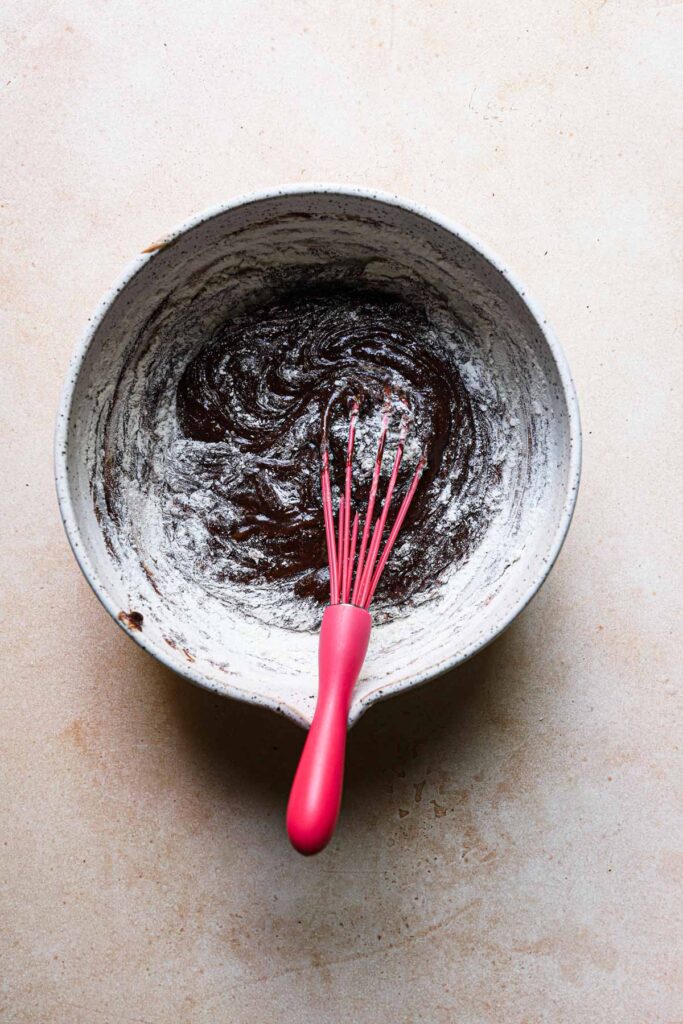 A bowl with chocolate flour mixture.