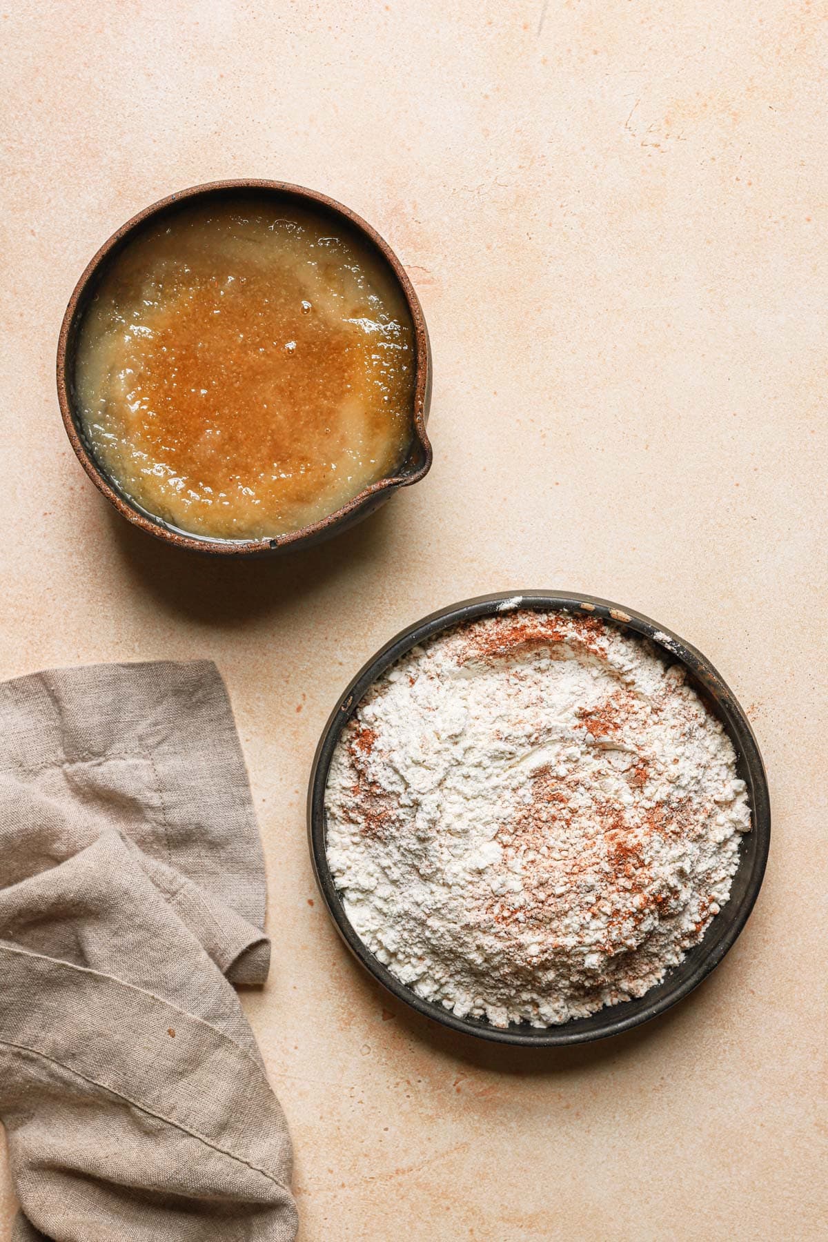 two bowls with ingredients for a cake.