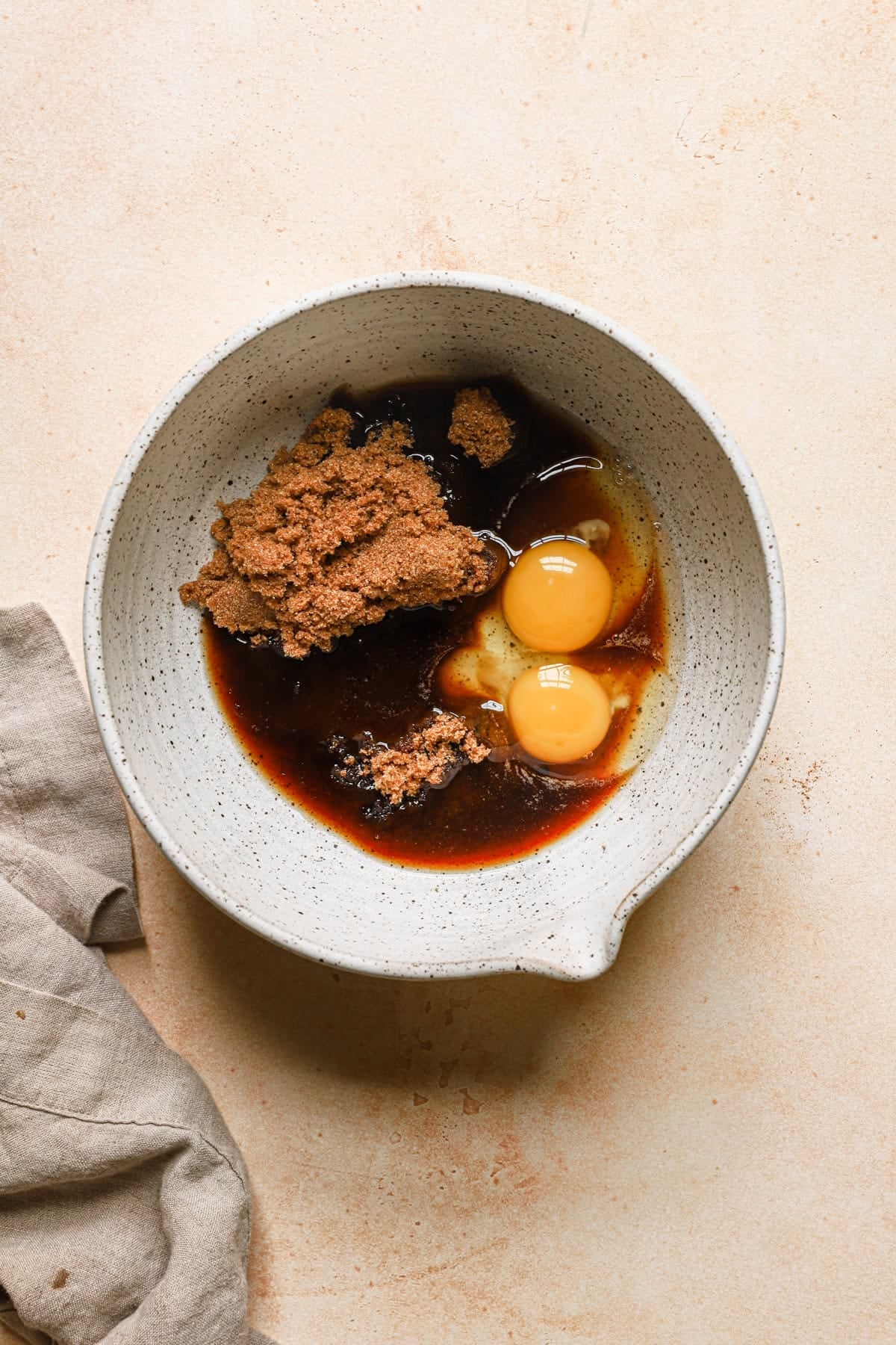 A large bowl with eggs and sugar.