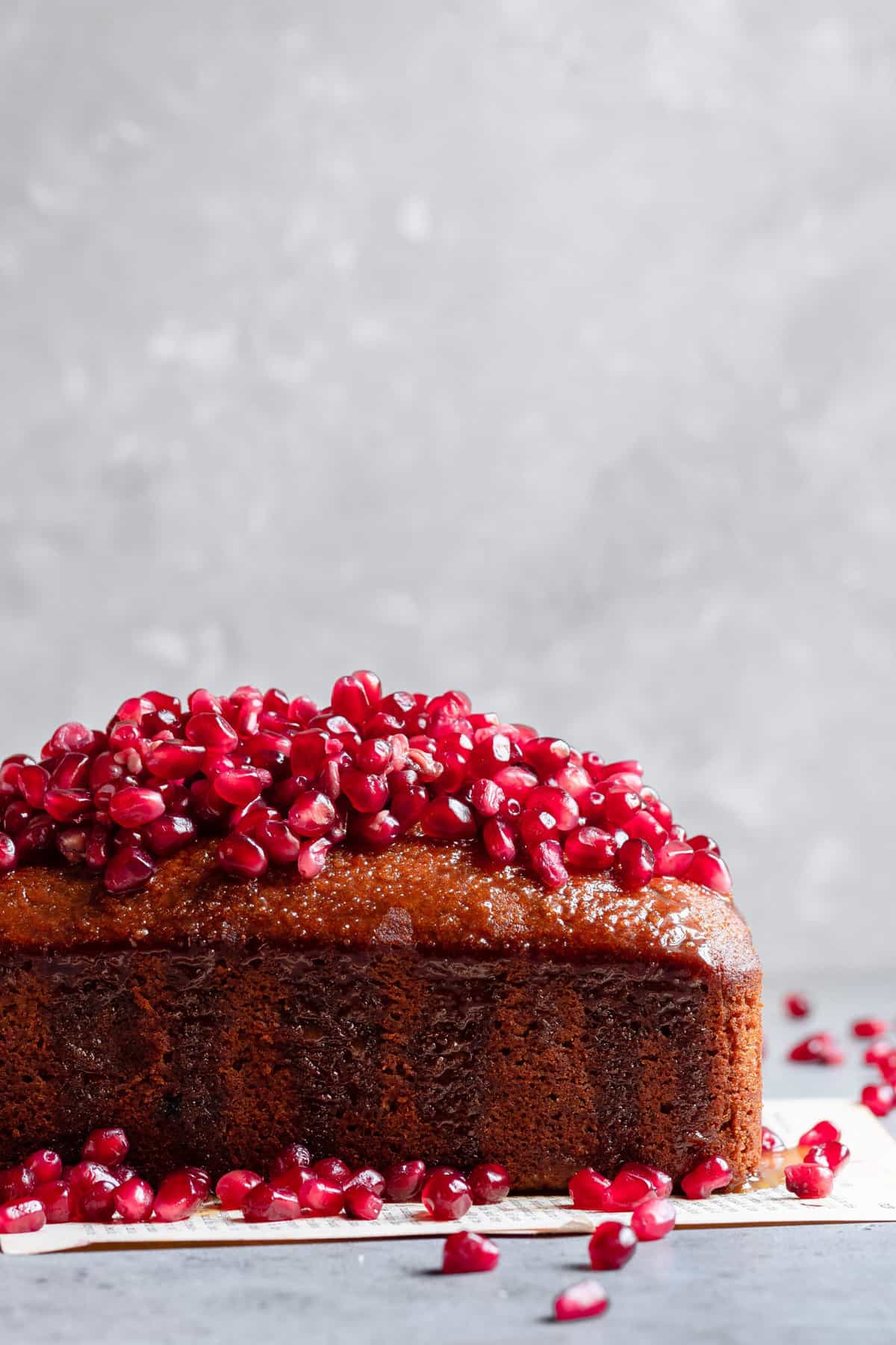 Honey dessert topped with pomegranate seeds.