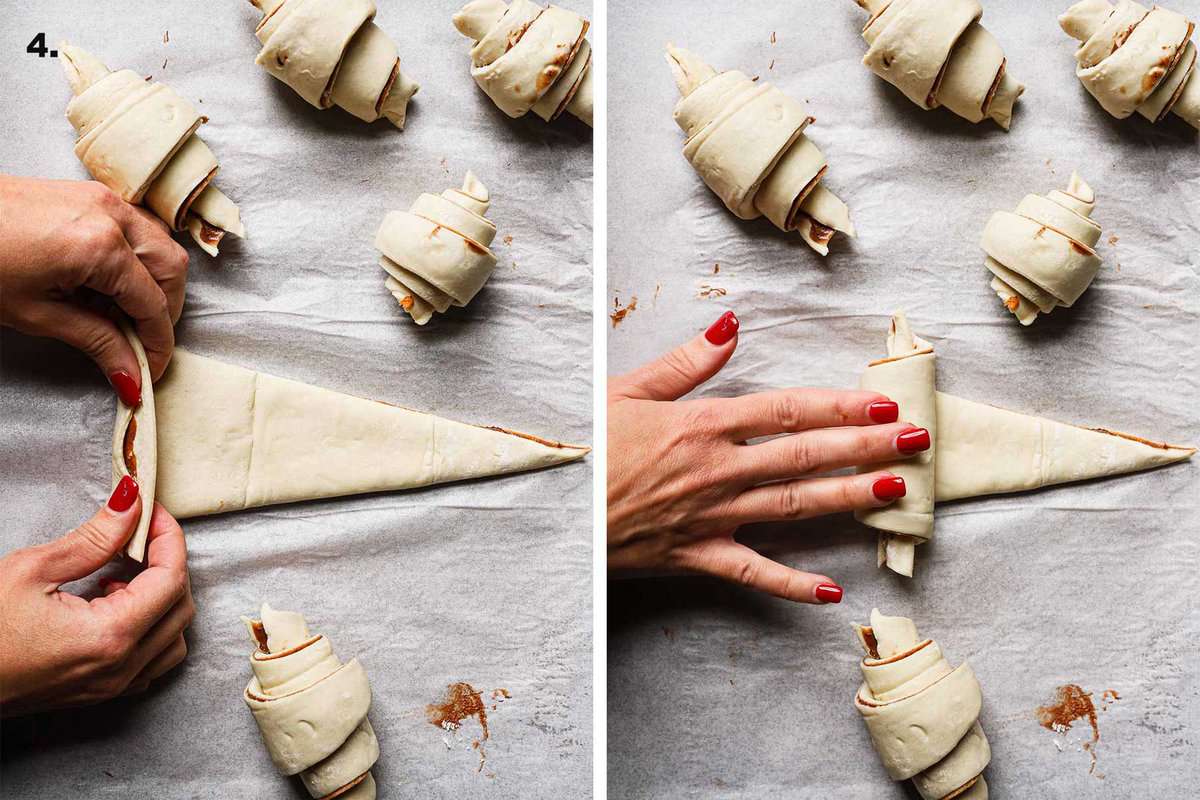 a hand rolling croissant