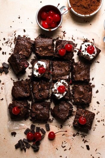 Brownies with cherries and whipped cream