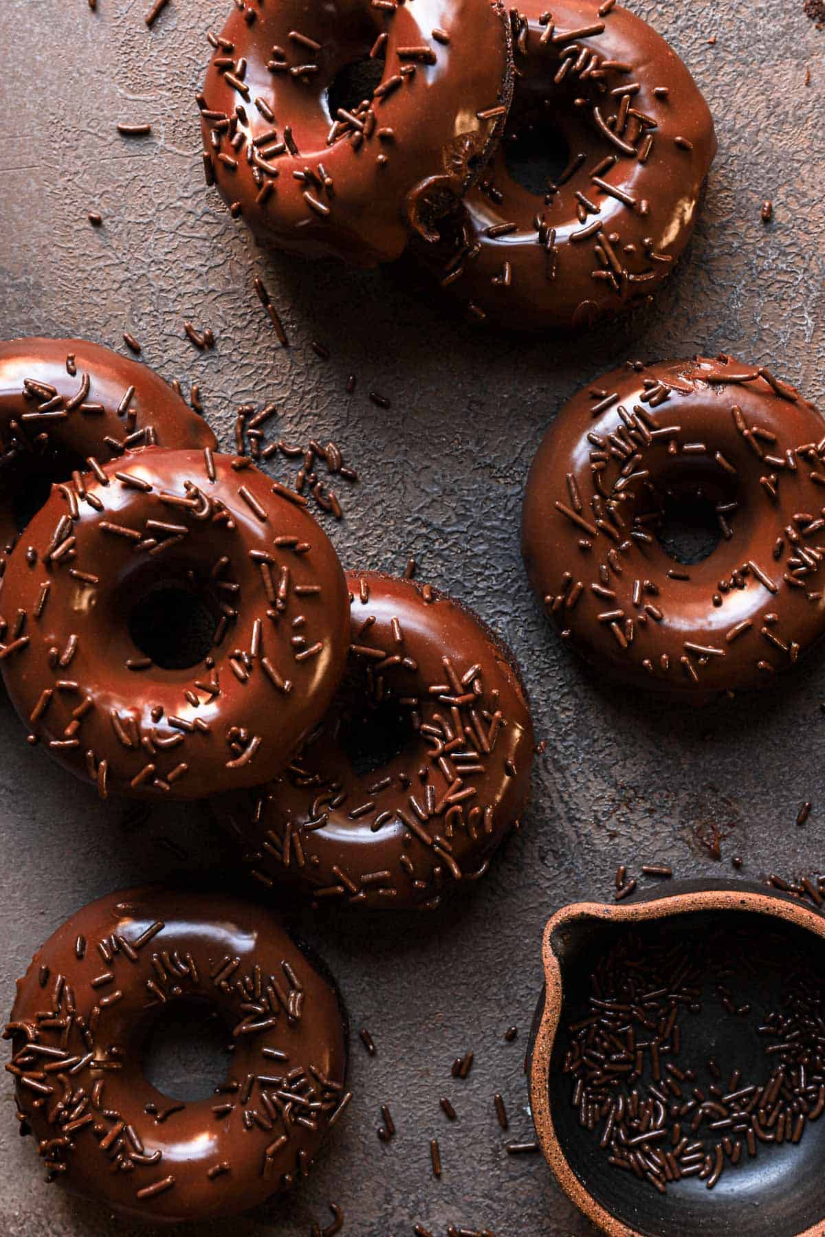 Baked donuts with chocolate glazed and sprinkles.