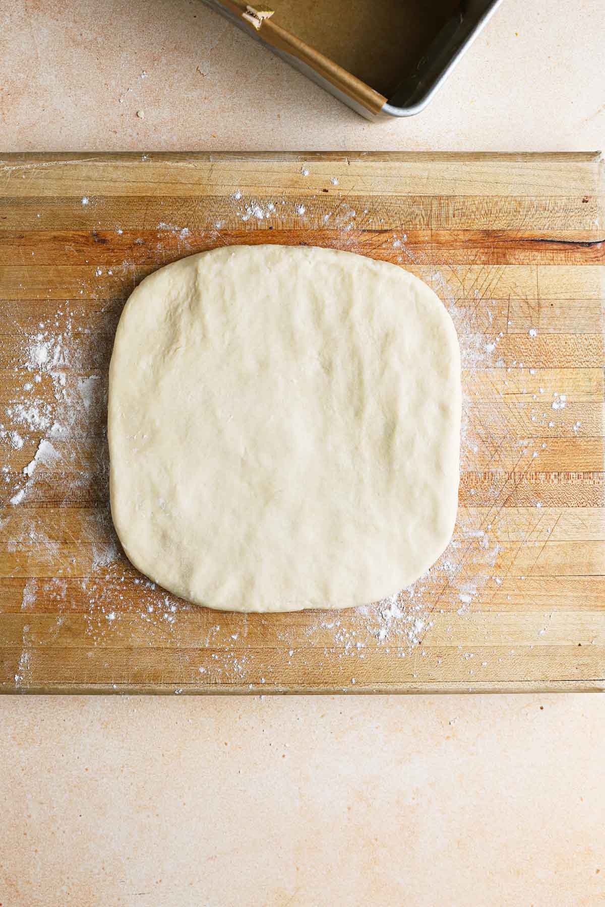 Brioche dough shaped into a square.