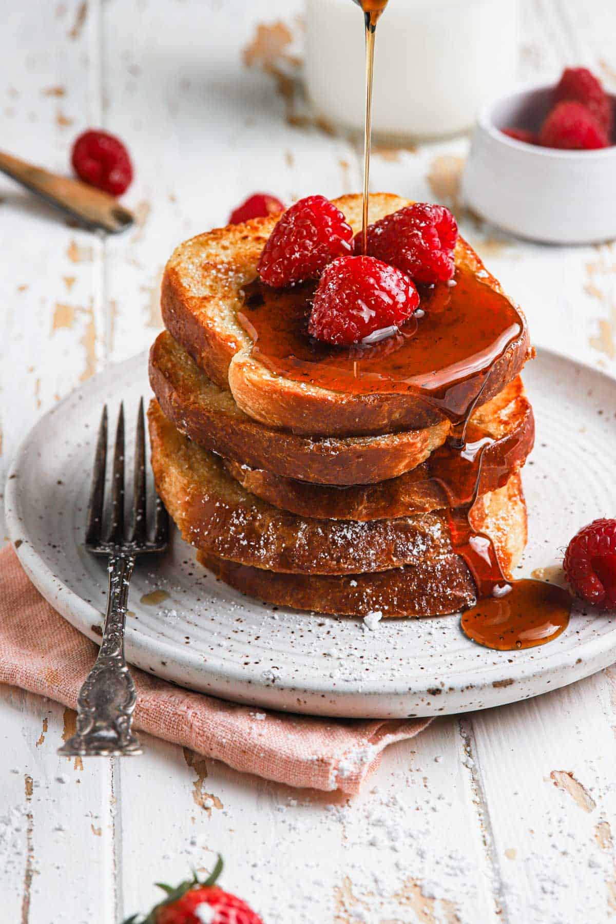 Brioche french toasts with berries and maple syrup