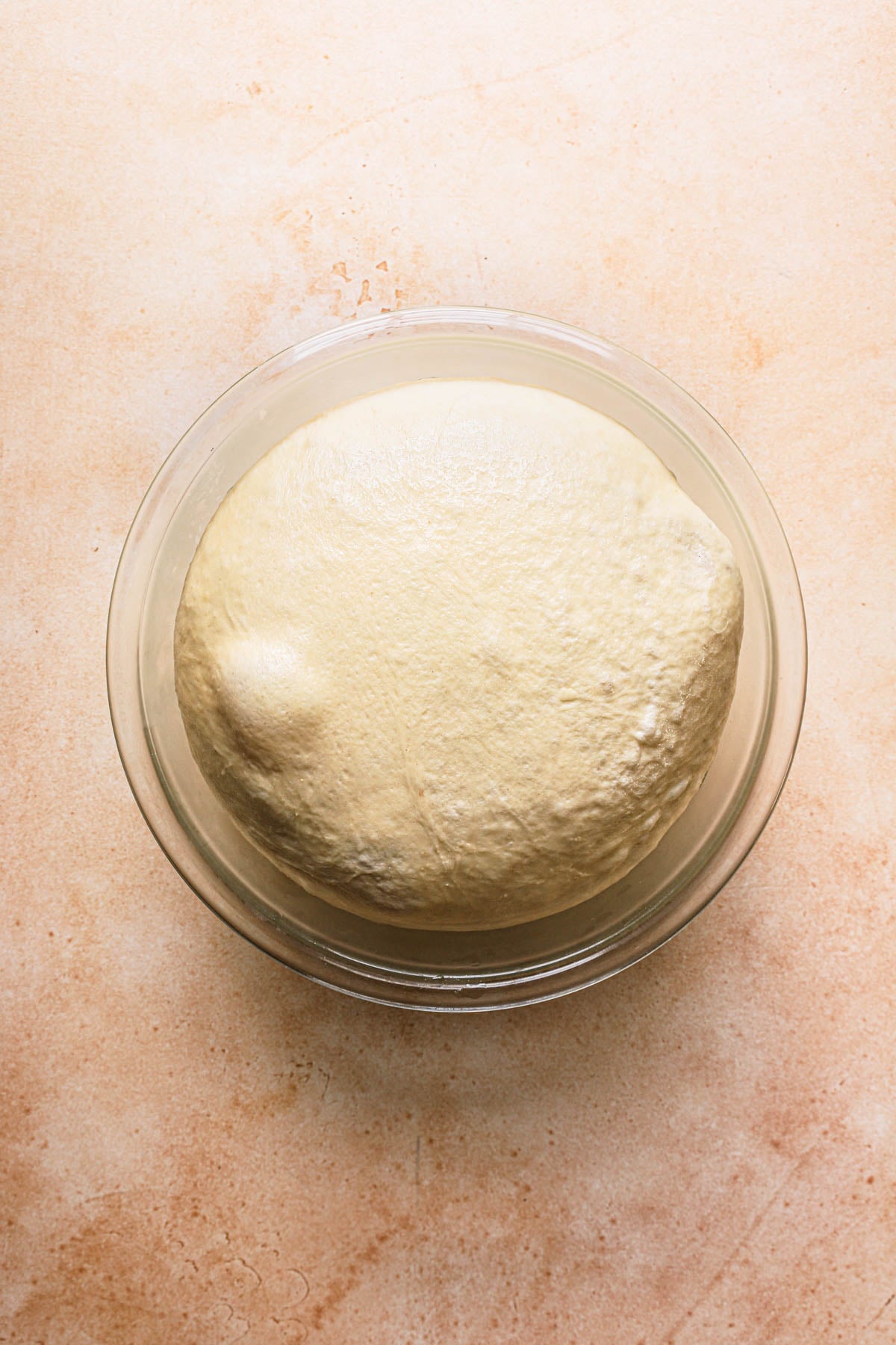 A bowl with proofed dough.