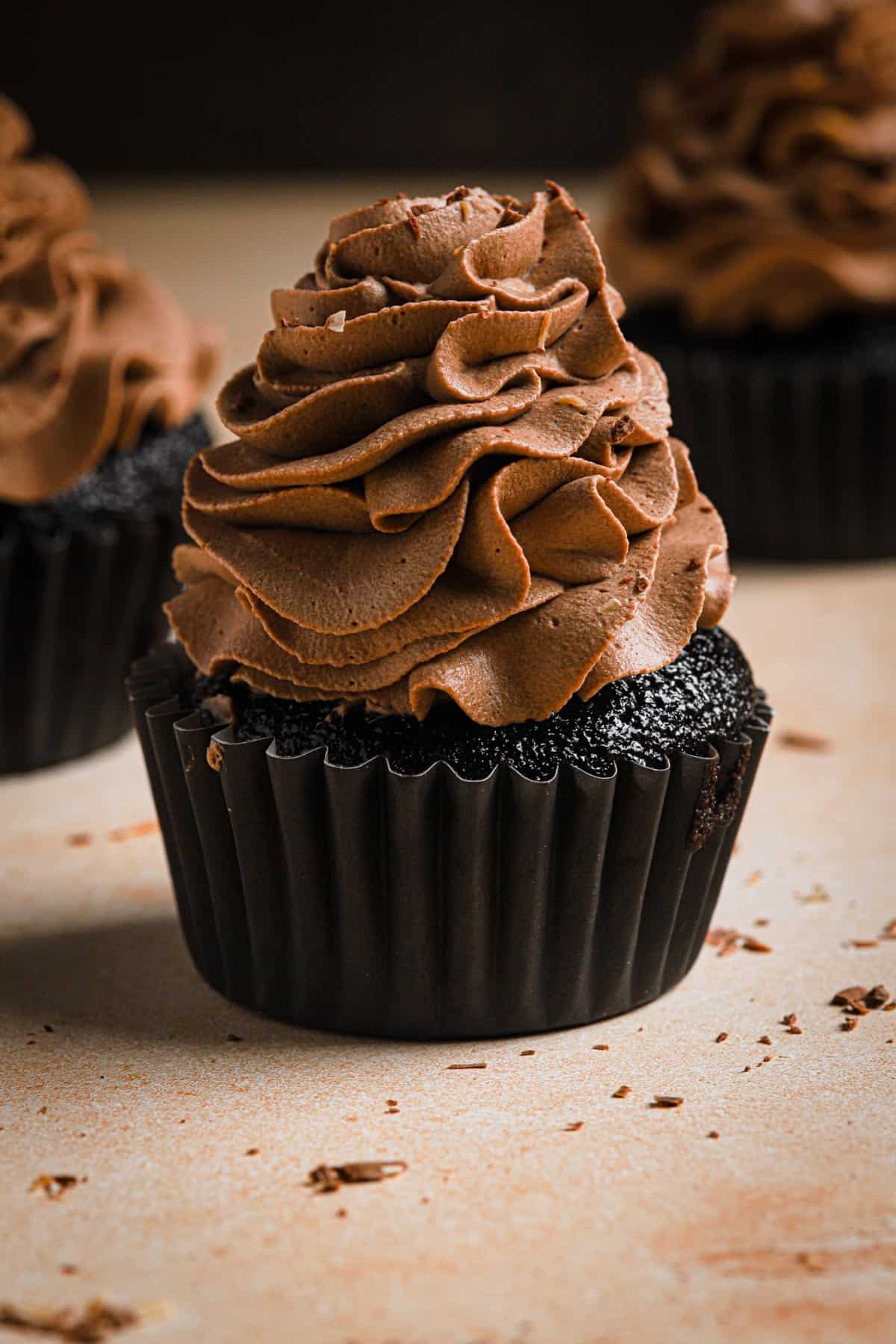 chocolate cupcakes topped with chocolate frosting