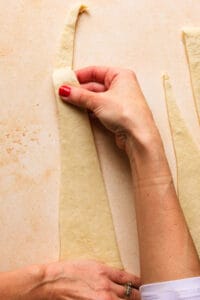 hands stretching dough