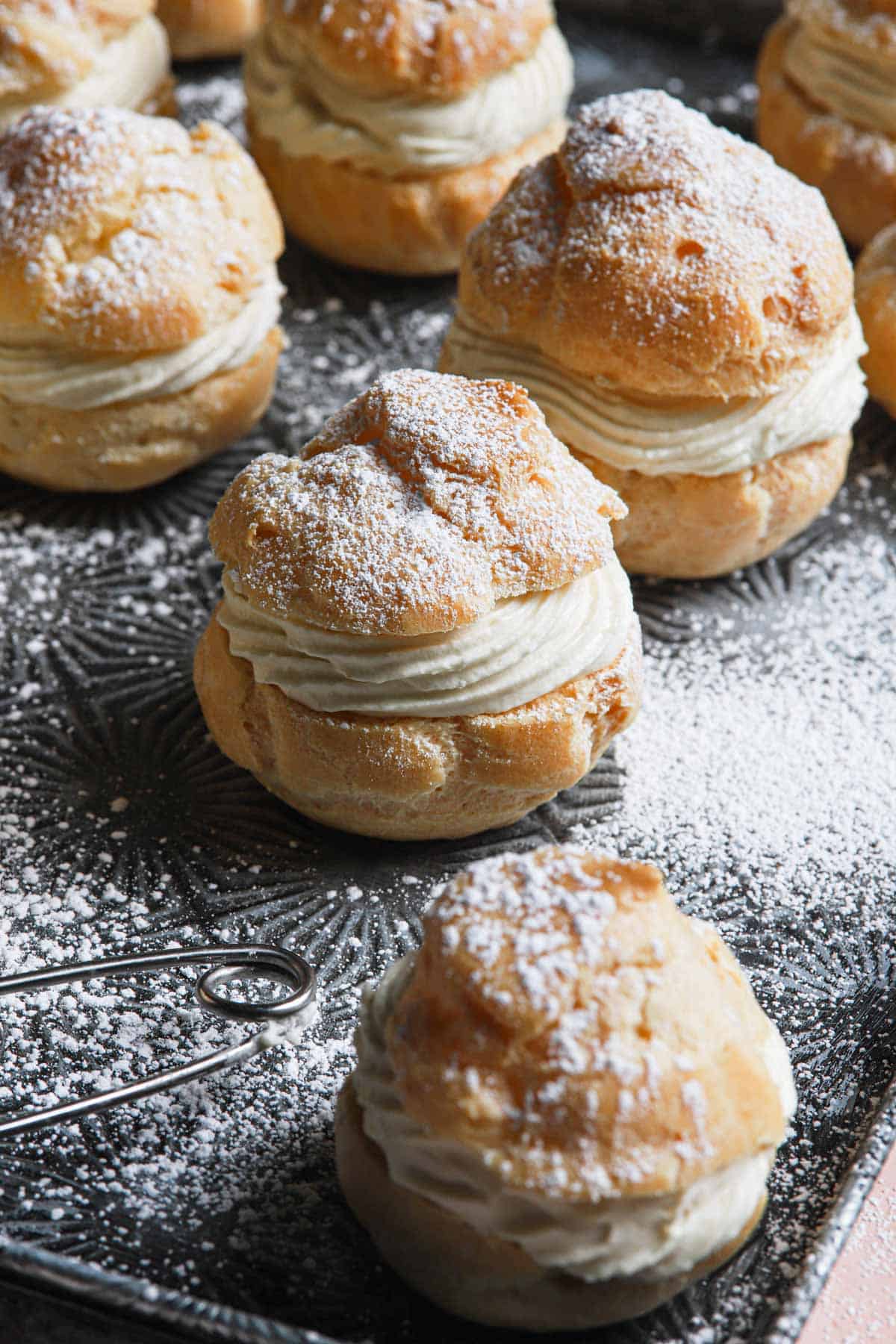 filled cream puffs in a tray