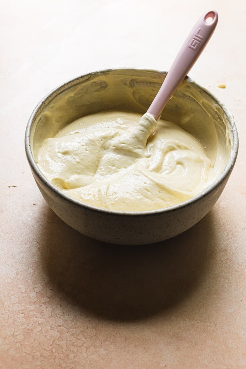 Meringue lightened pastry cream in a bowl with a spatula