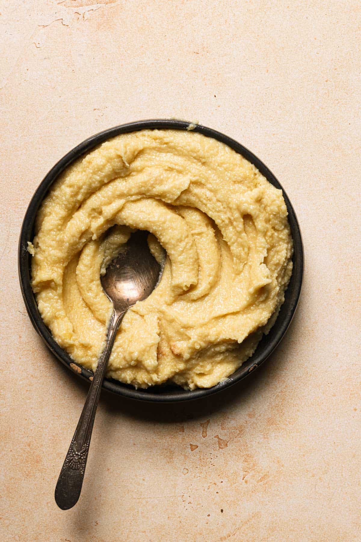 almond cream filling in a bowl with a spoon