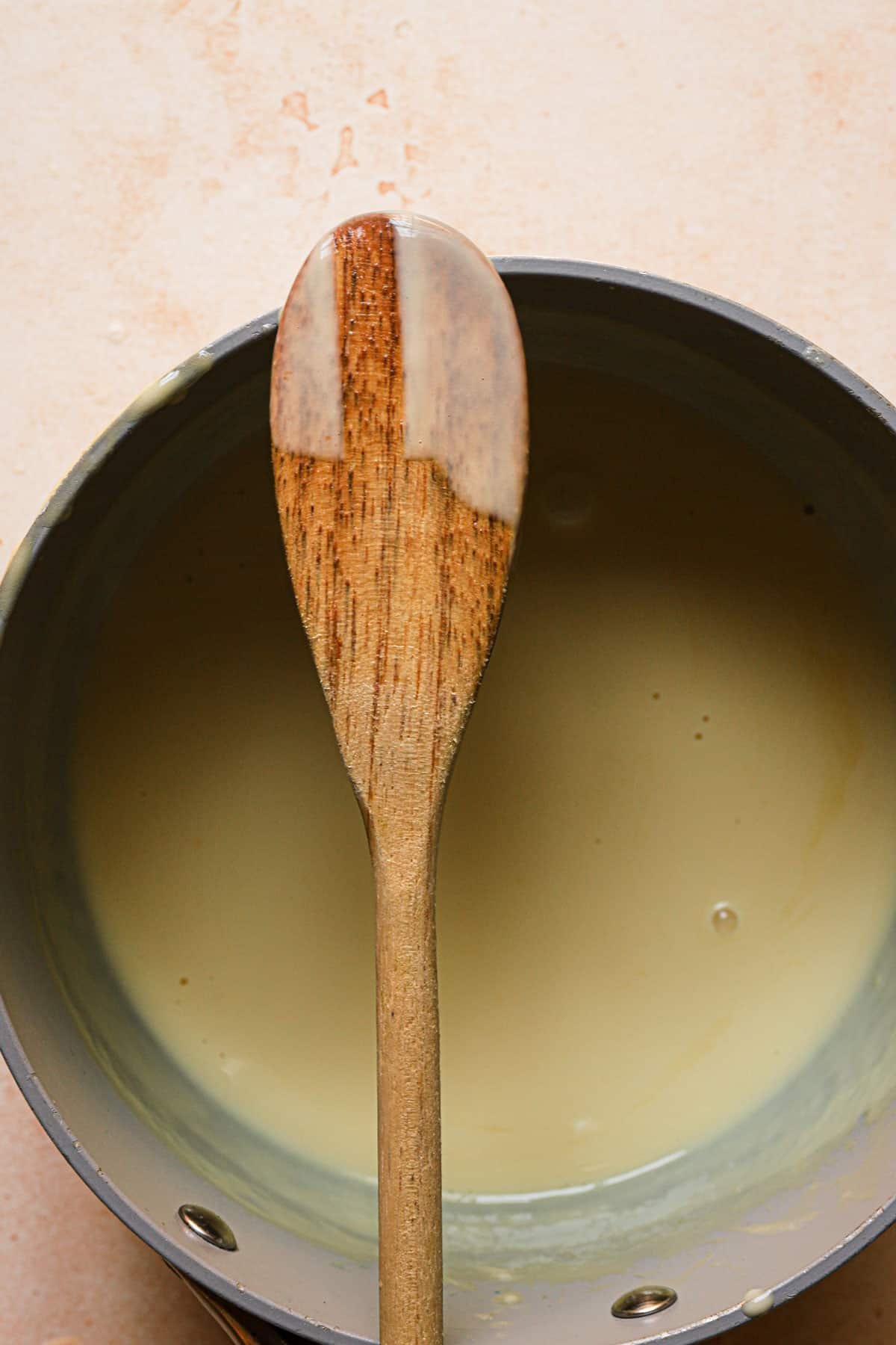 a spoon with creme anglaise