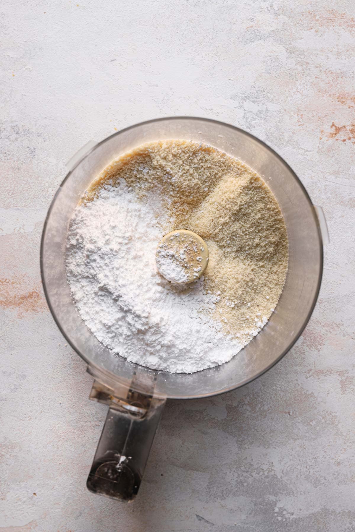 almond meal and powdered sugar in a food processor