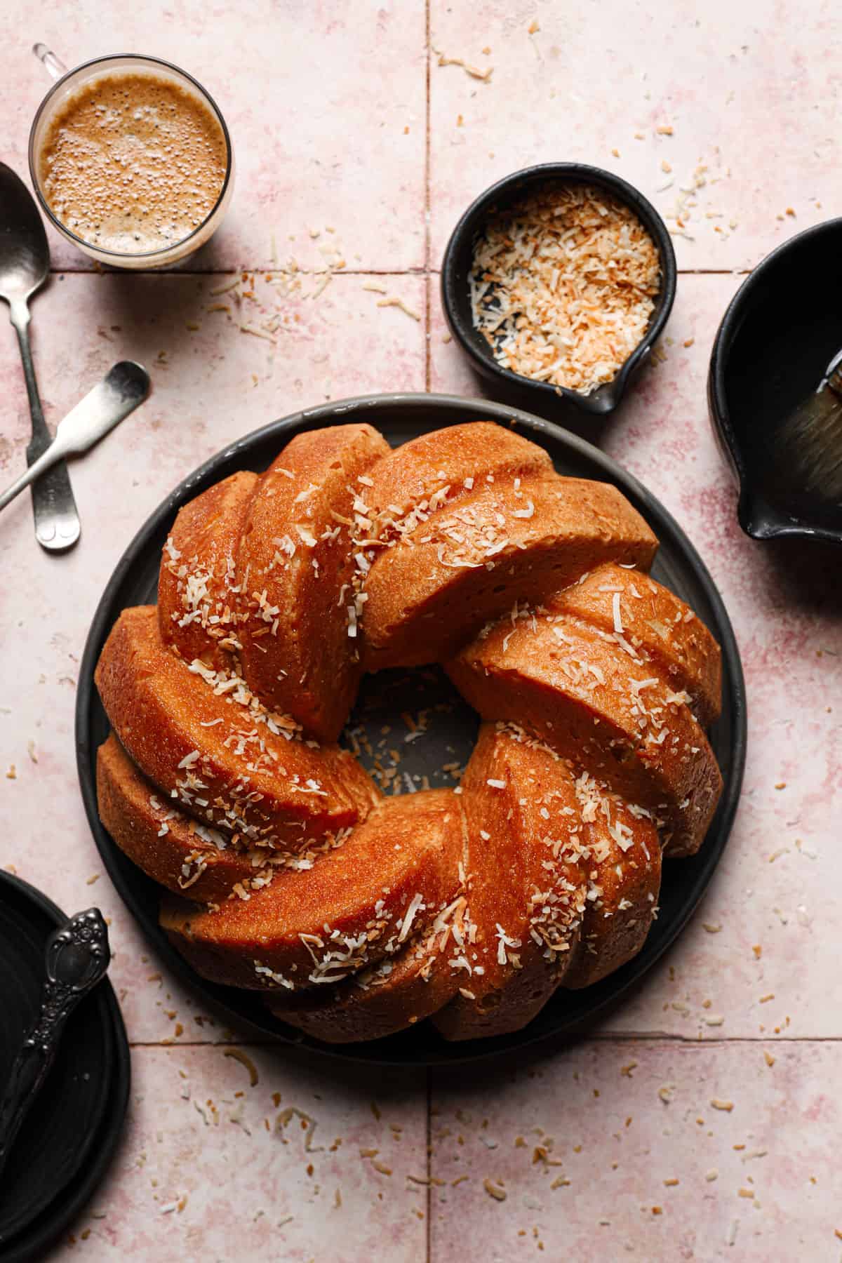 bundt pan in a plate sprinkled with shredded coconut