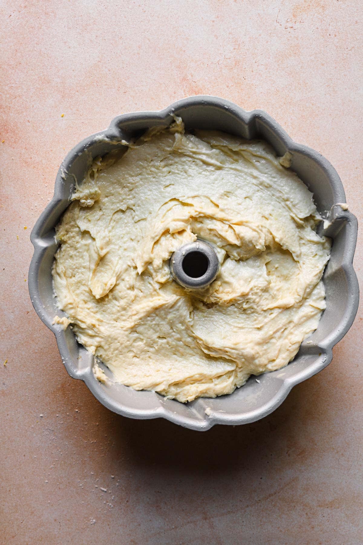A bundt pan filled with unbaked cake batter.