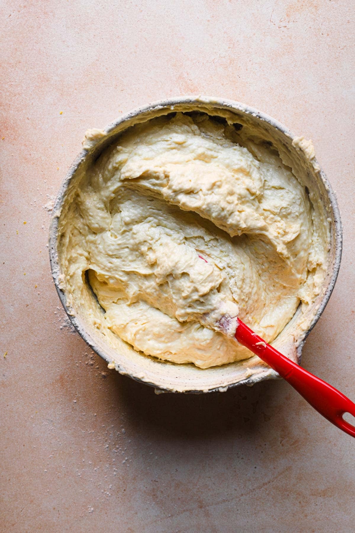 A spatula mixing ciambellone cake batter.