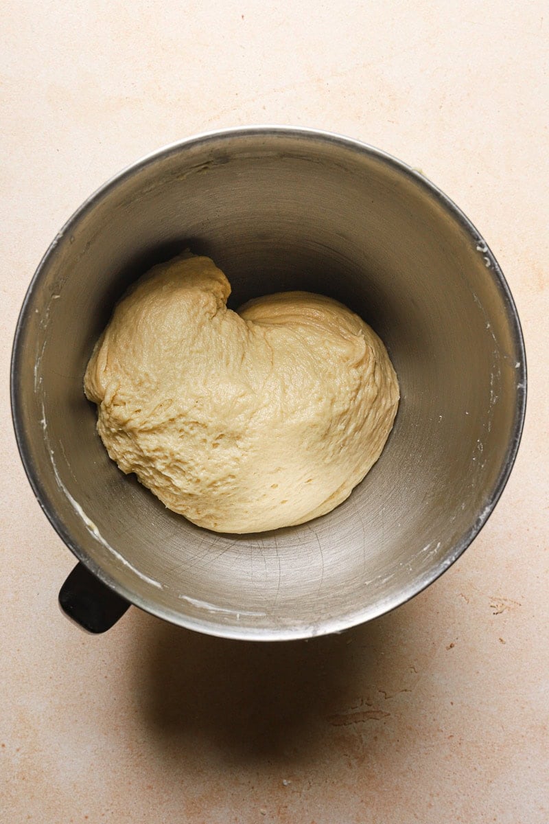 Portuguese brioche dough in a bowl of a stand mixer.