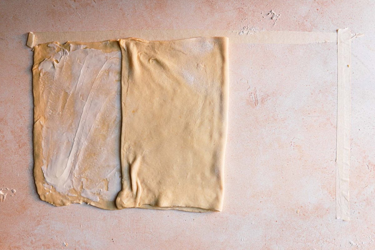 Folding rectangle dough over the center.