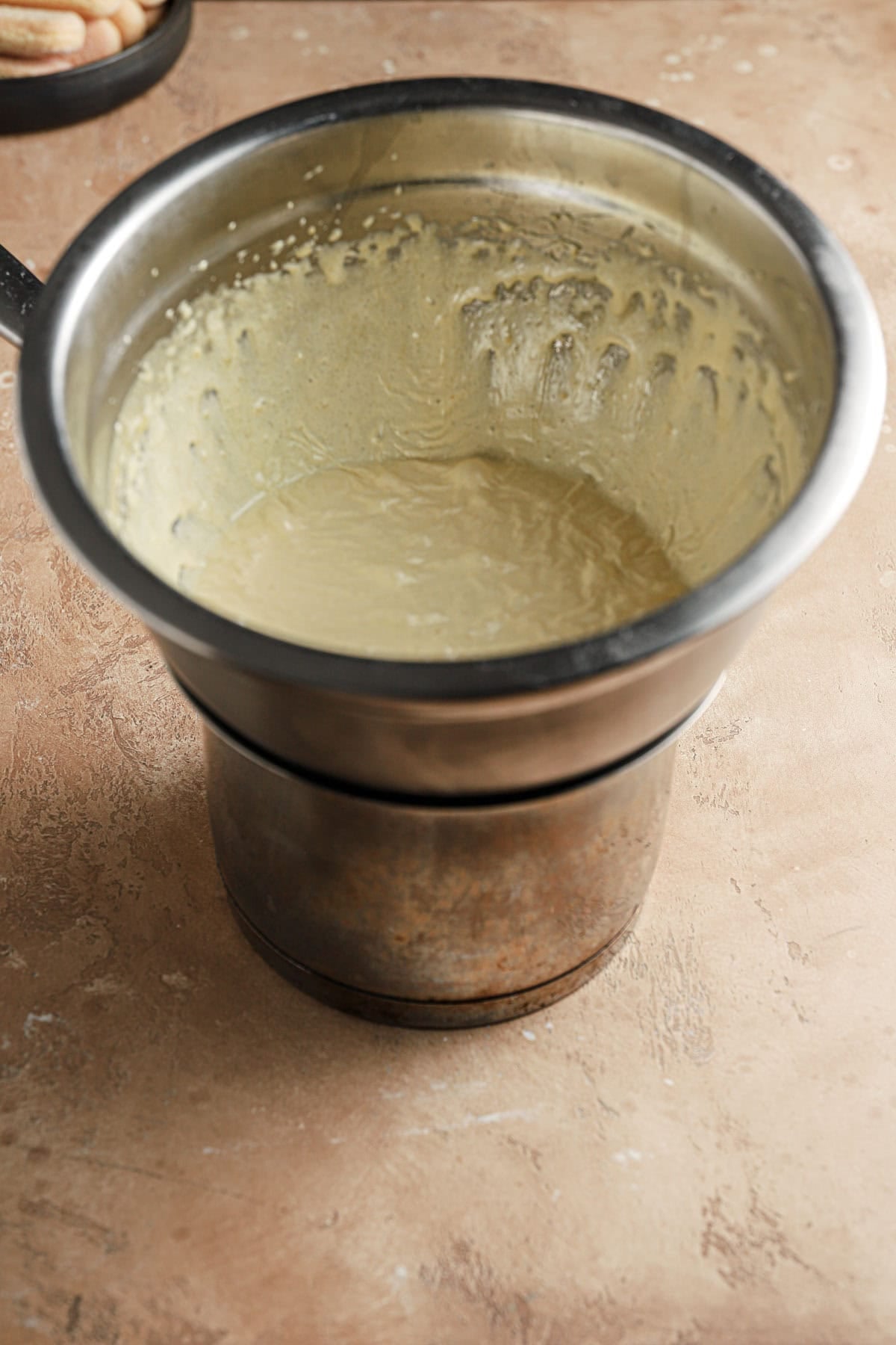 A double boiler with egg yolks mixture.