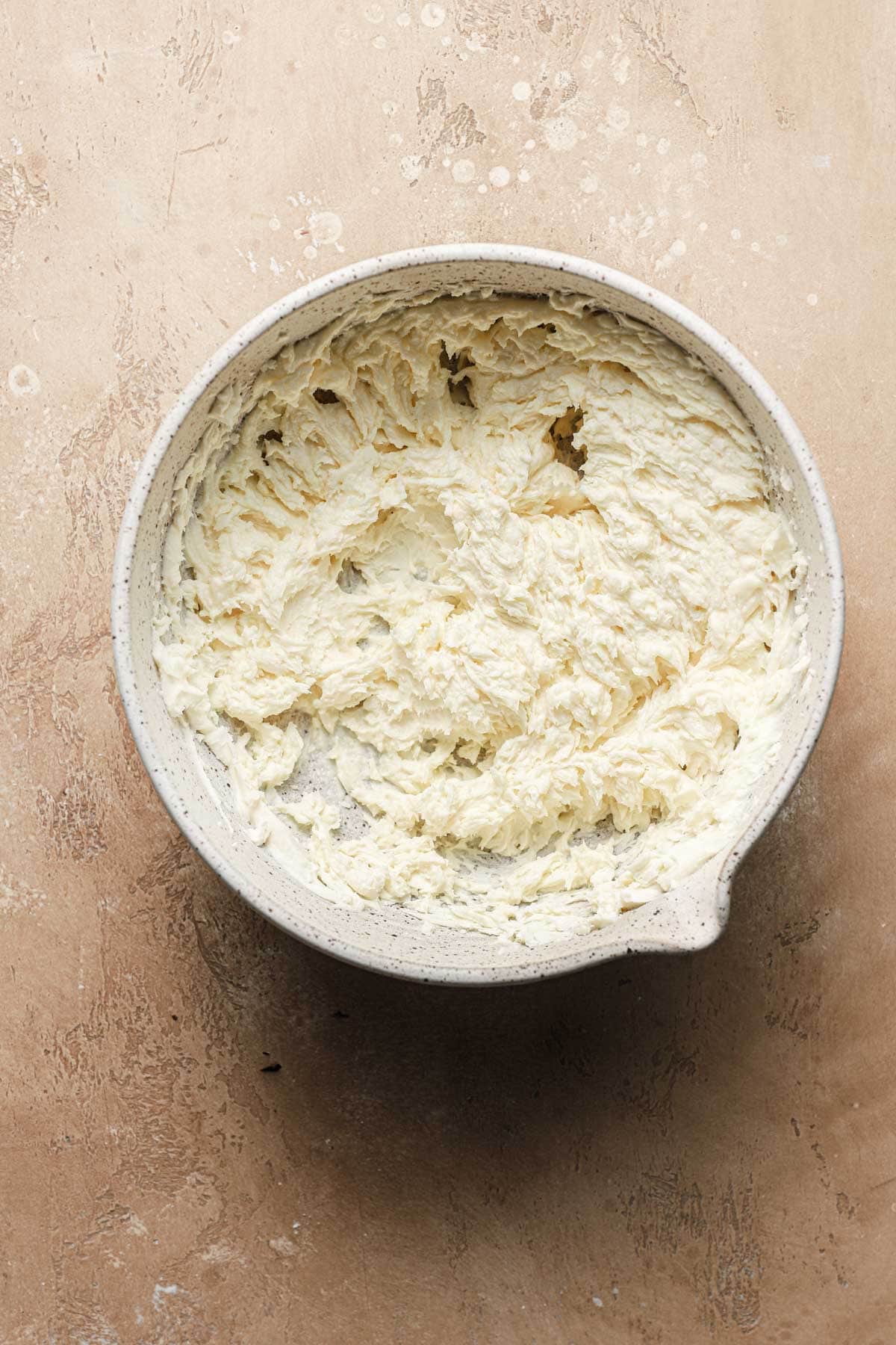 A large bowl with whipped mascarpone cream.