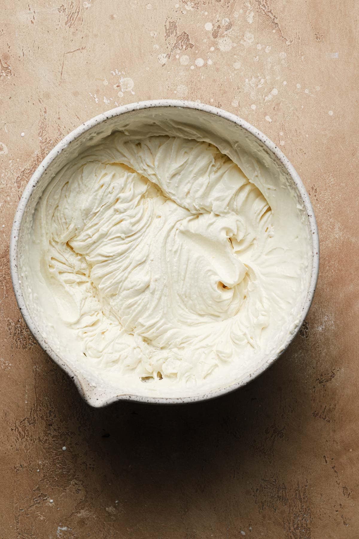 A large bowl with whipped mascarpone cream for tiramisu..