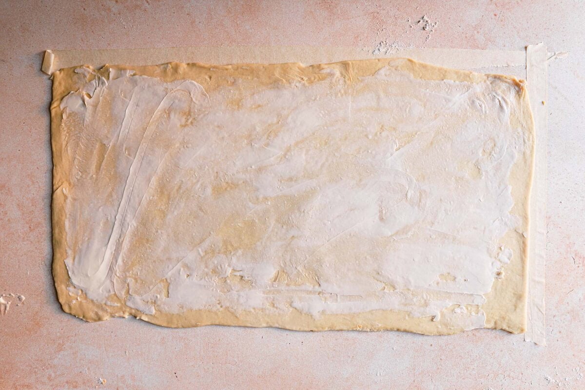 Dough rolled into a rectangle and spread with a thin layer of butter.