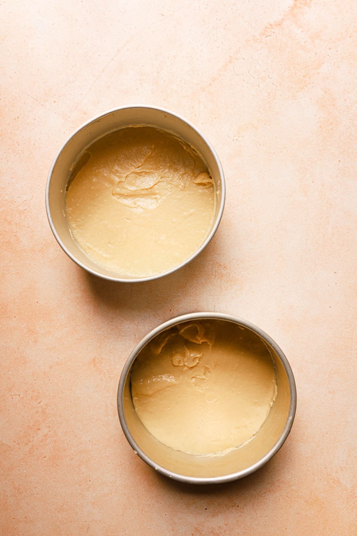Un baked choux paste divided into two pans.