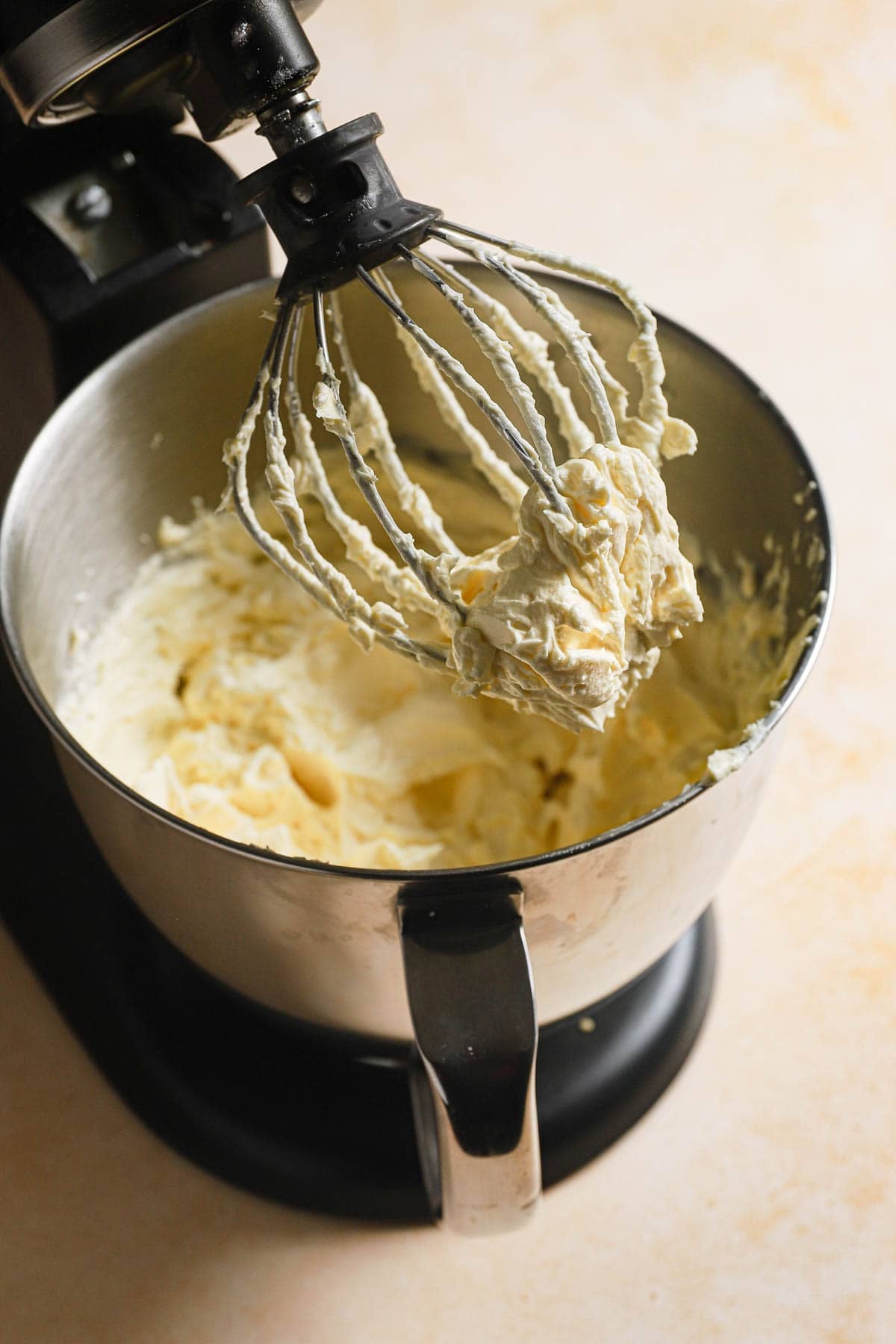 Creme mousseline in a bowl of a stand mixer.