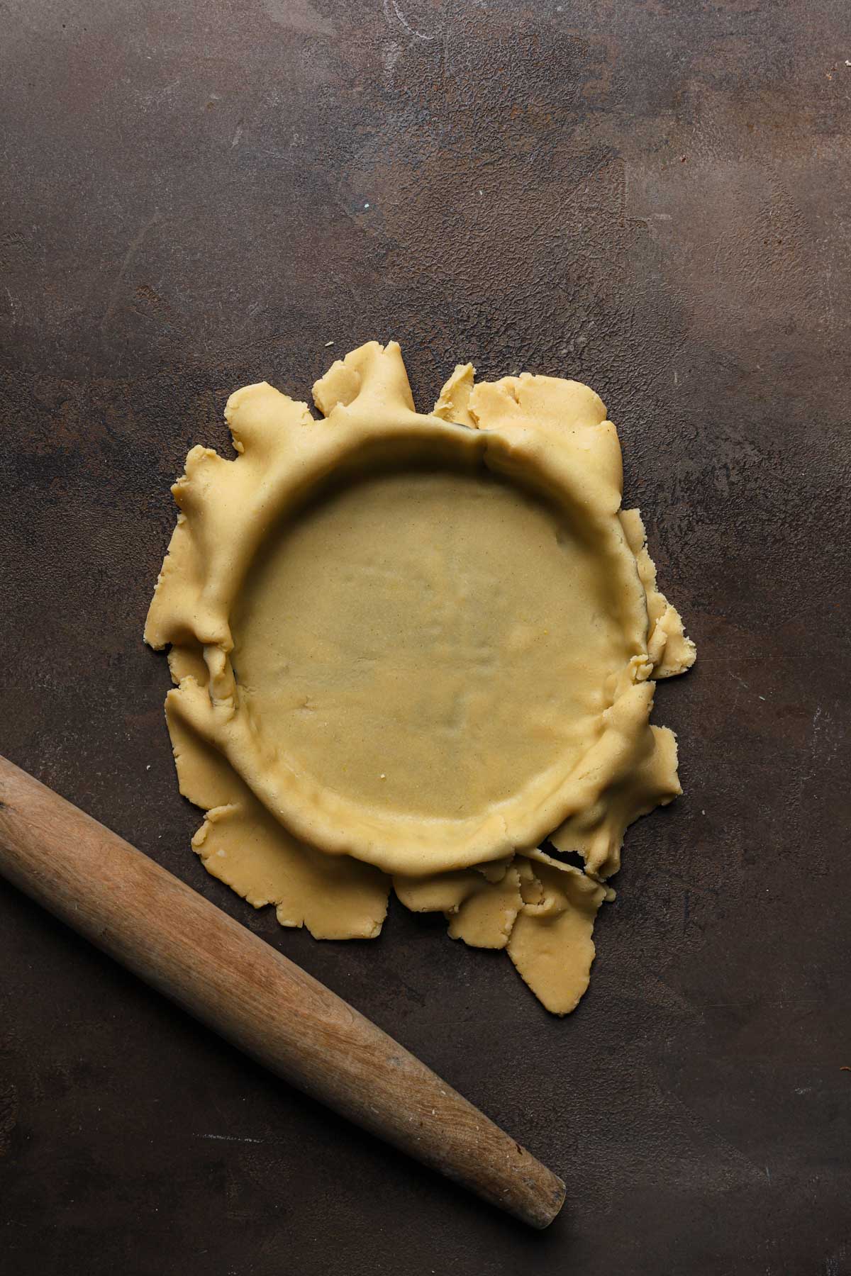 dough lines over a tart pan.